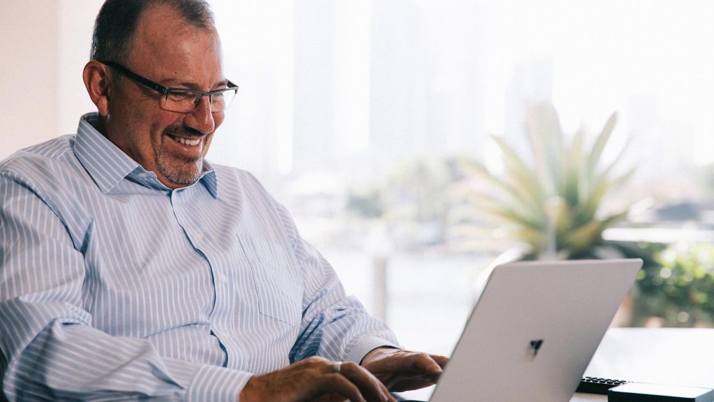 paul forbes rfs advice ceo working on a laptop